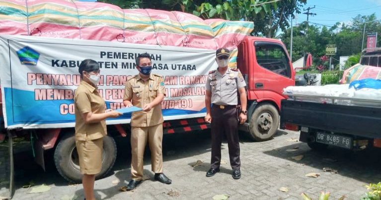 Polsek Kauditan Kawal Penyaluran Bantuan Pemkab Minut 